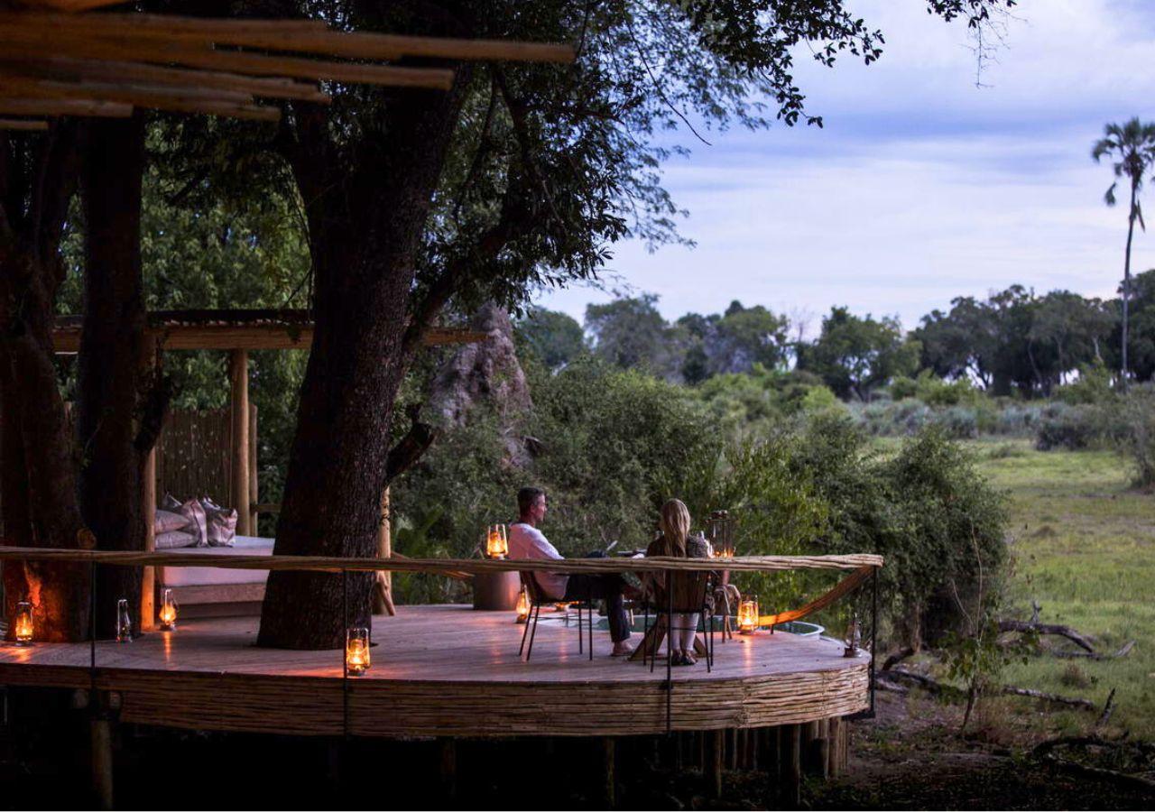 Couple on a private deck at a safari camp in Botswana