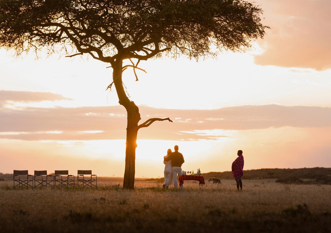 Couple spotting a hyena on sundowner experience with Ol Seki in Kenya