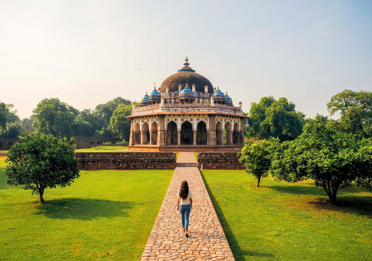 woman walking towards Humayan's Tomb in Delhi India