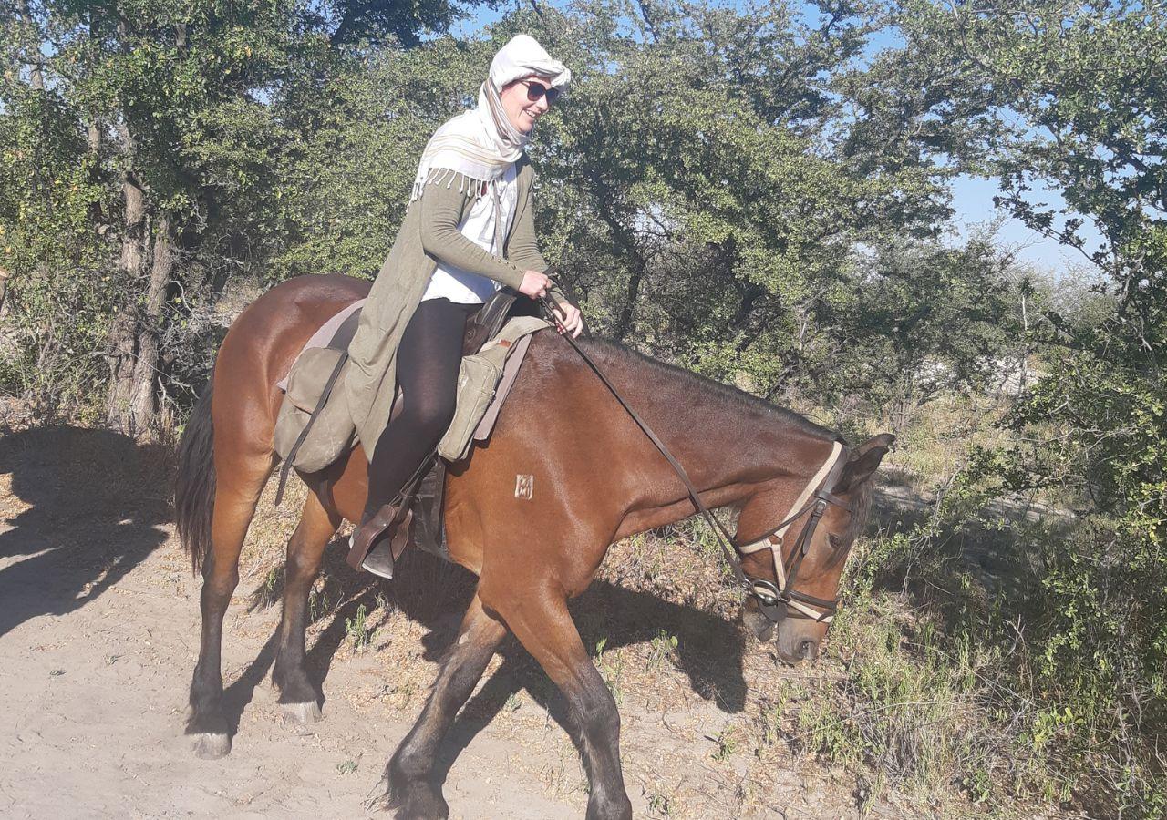 Meike riding on a horse safari