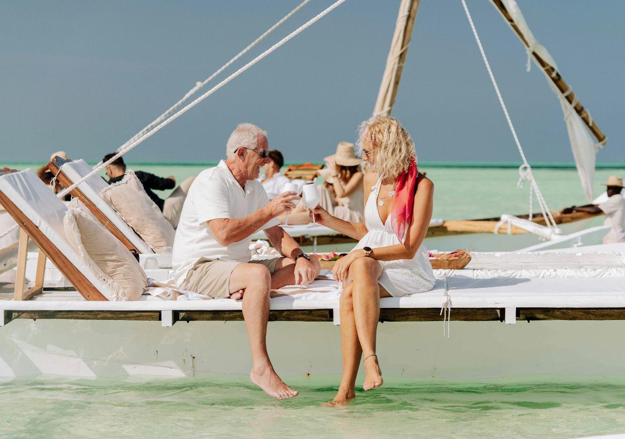 Older couple enjoying drinks on a boat in Maldives