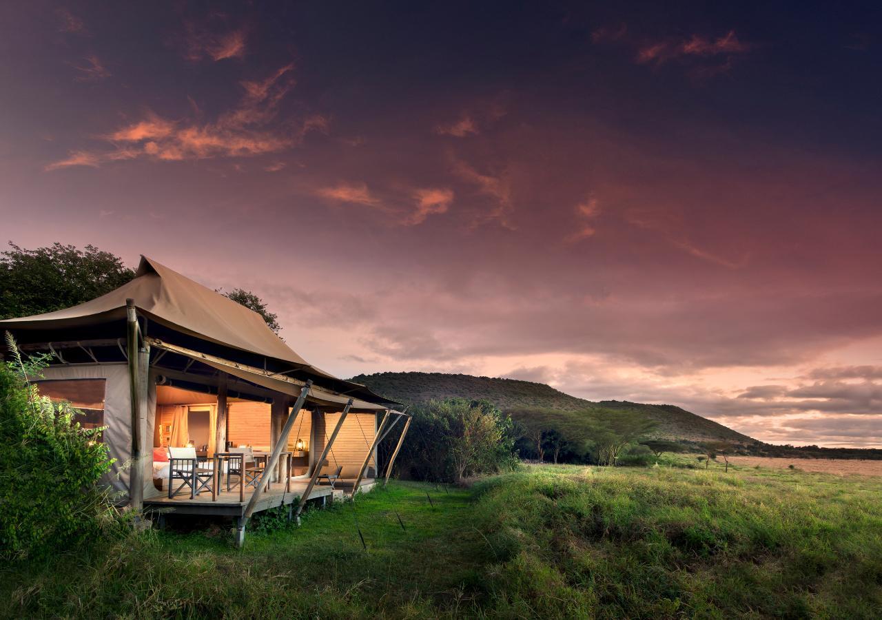 luxury tented safari camp in Kenya at sunset