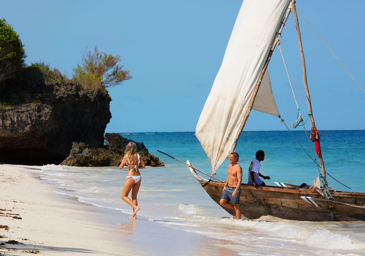 couple getting off a traditional dhow in Tanzania