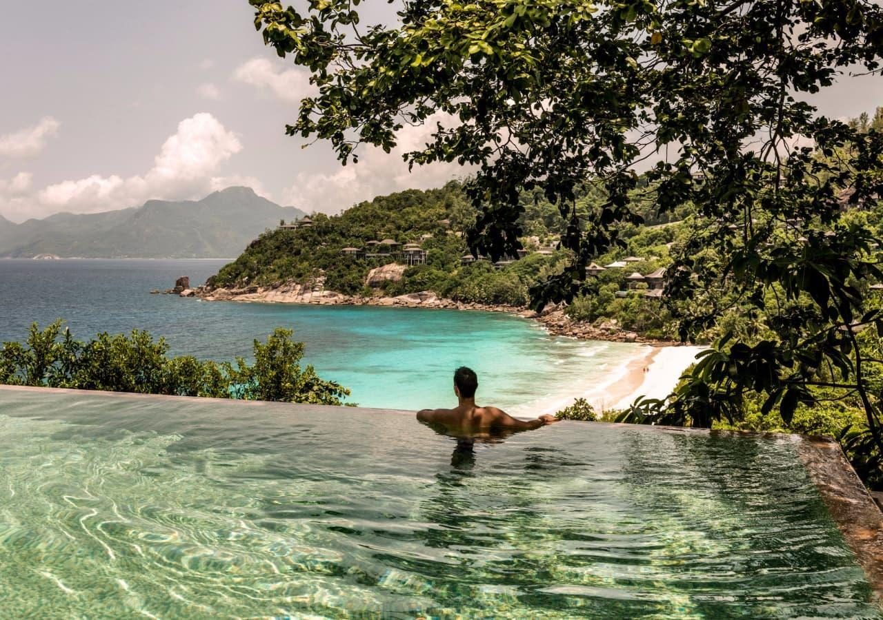 Infinity pool with beach view at Four Seasons