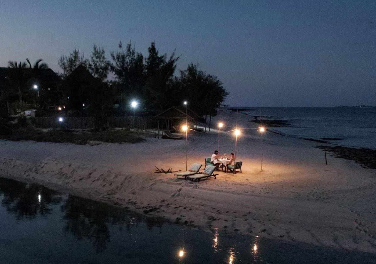 B romantic dinner set up on the beach