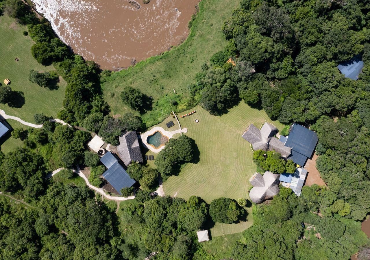 House in the Wild Aerial View of Property