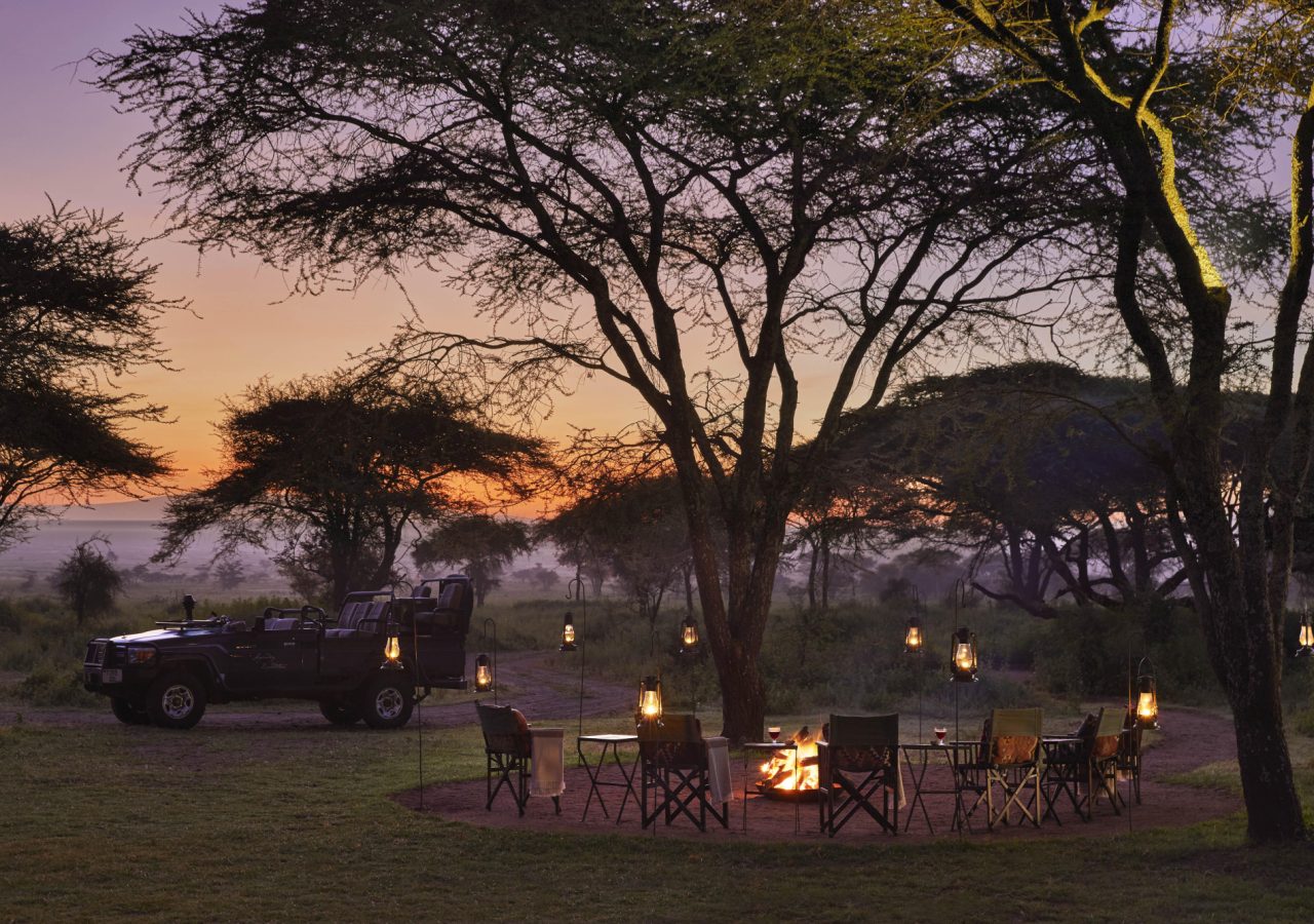 Songa Migrational Camp boma sundowners with vehicle