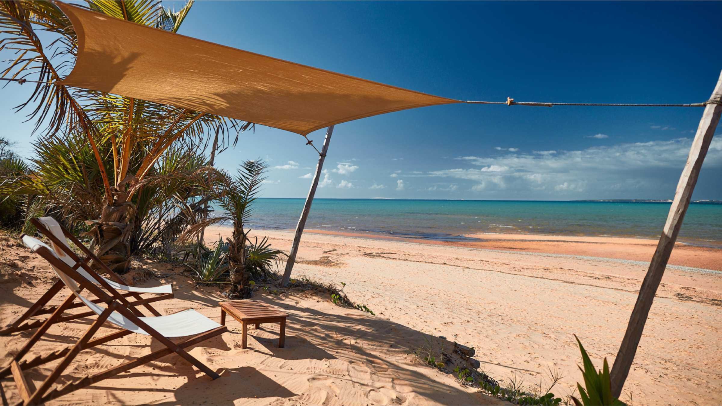 As Dunas Hero image of beach loungers looking out on to the beach