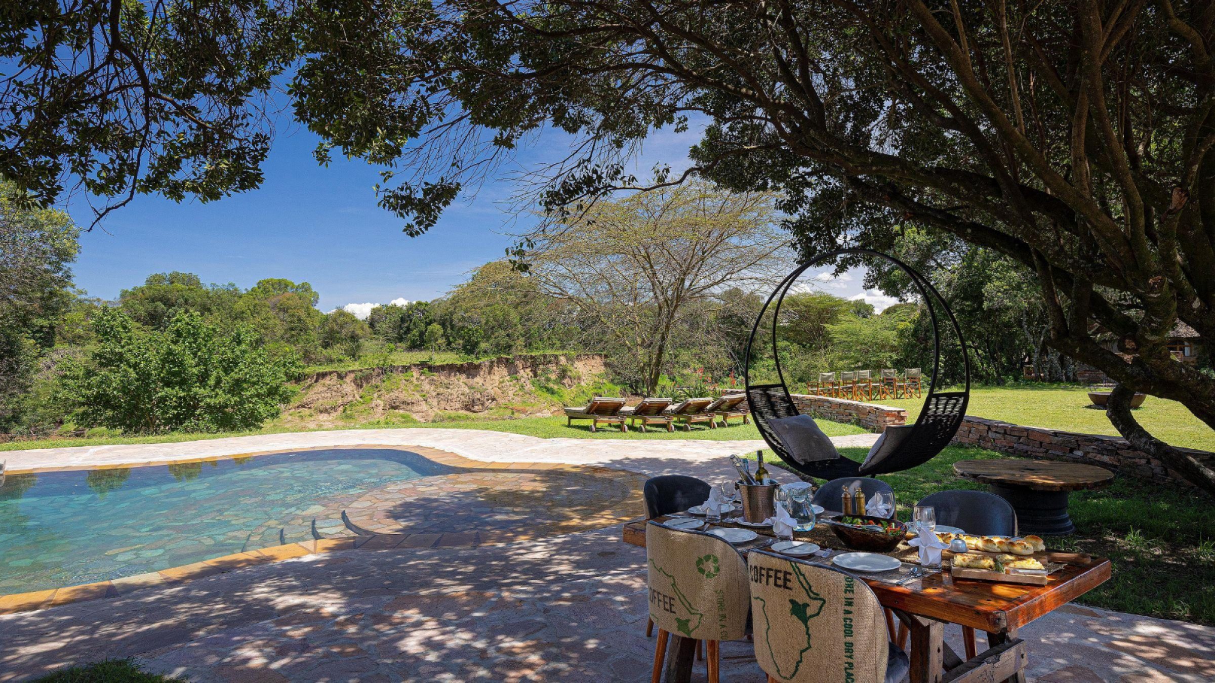 House in the Wild Hero image of swimming pool and patio