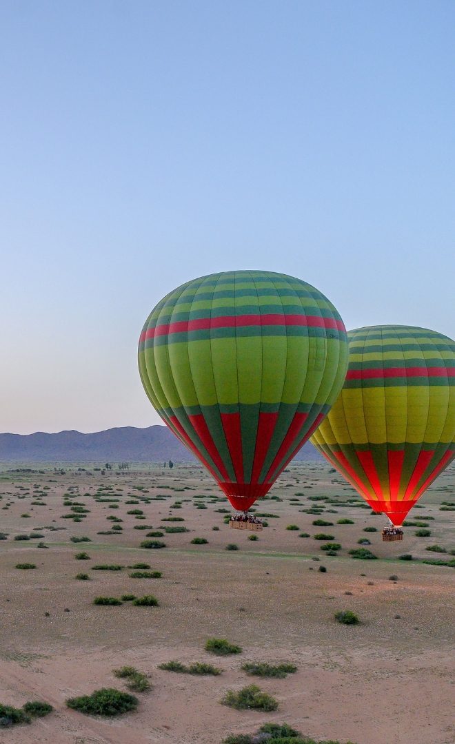 hot-air balloons over Morocco desert at sunrise