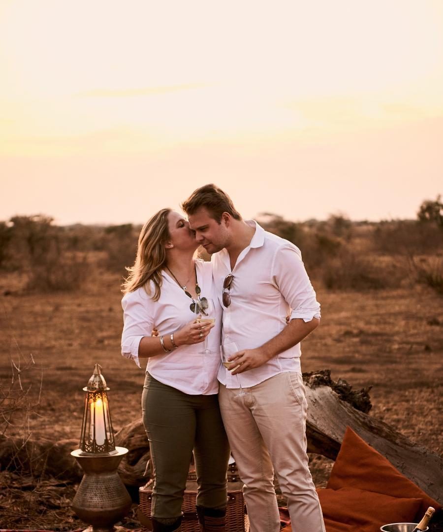 Honeymooners enjoying sunset drinks in Kenya