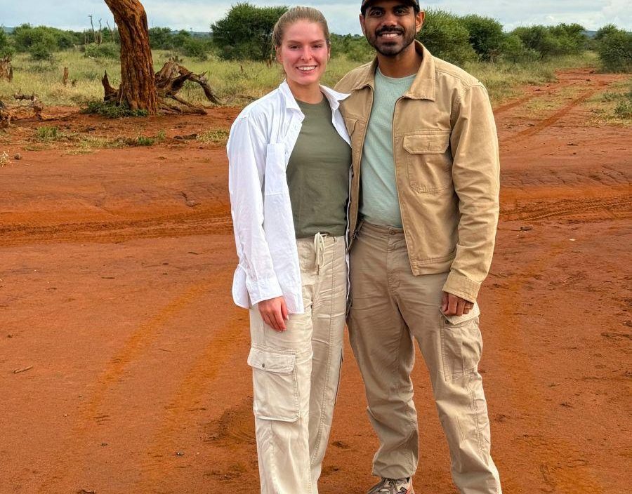 Couple pose while on safari