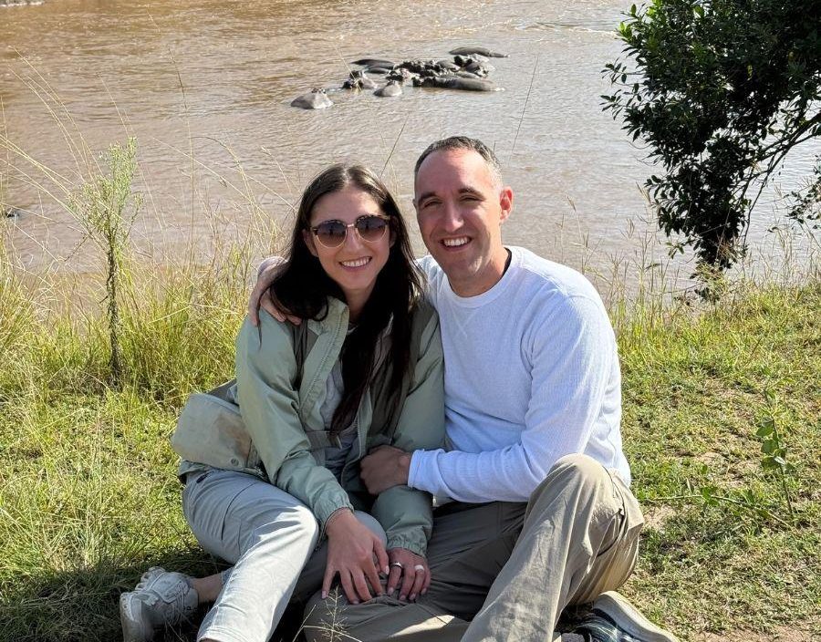 Couple pose in front of crocodile infested river in Kenya