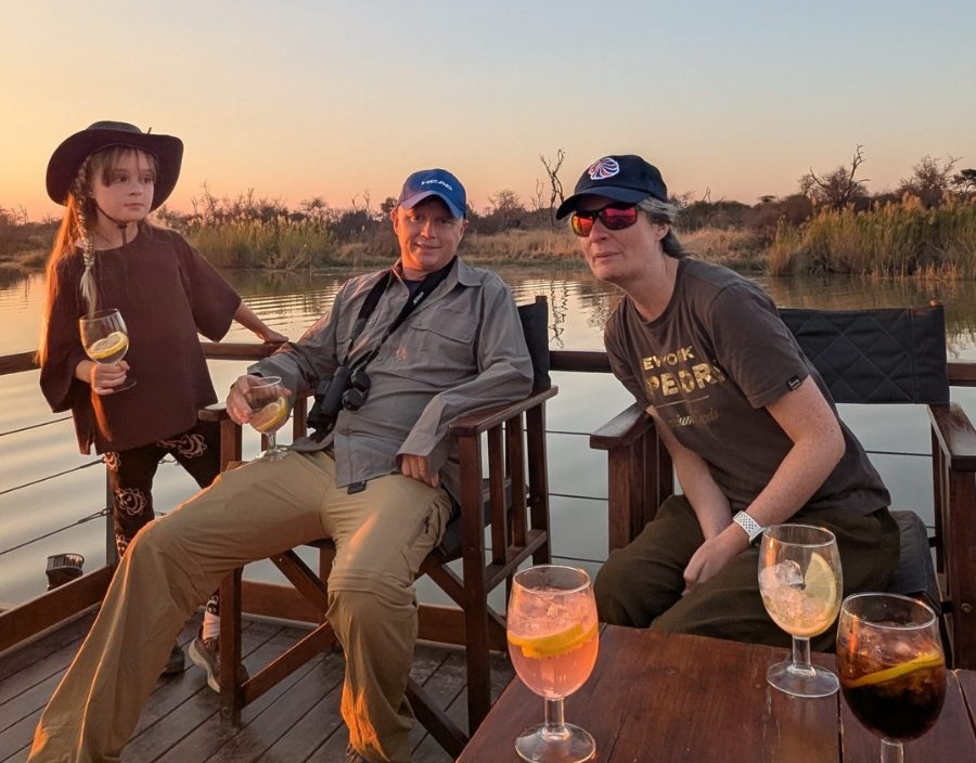 family pose on house boat