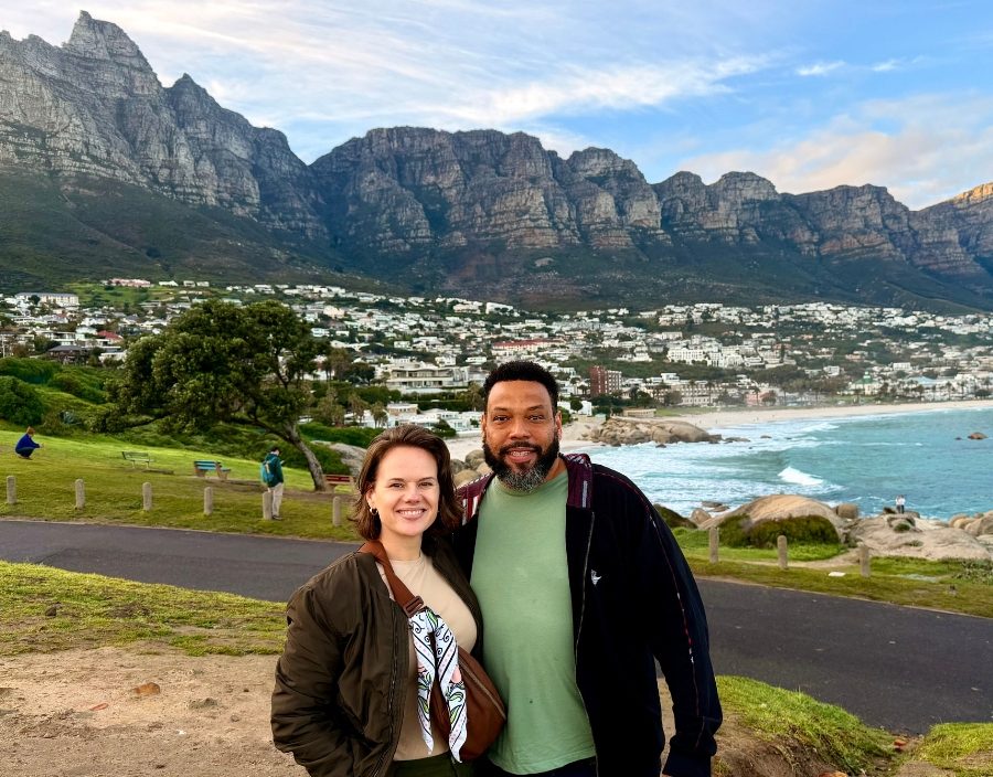 couple pose in front on 12 apostles in camps bay