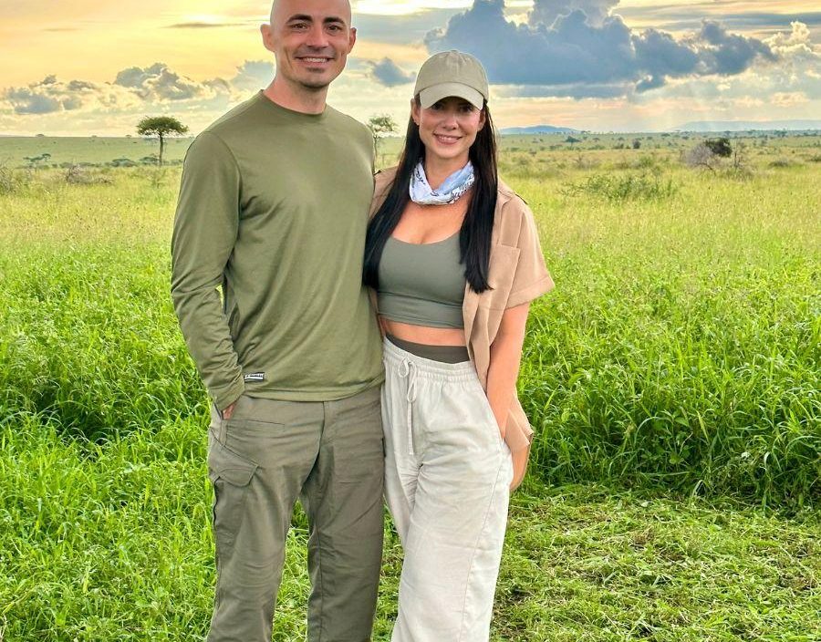 Couple pose for photo on safari in Tanzania