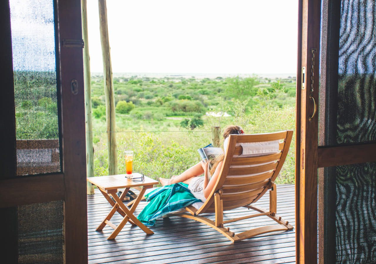 Tau pan camp relaxing on the deck 1280