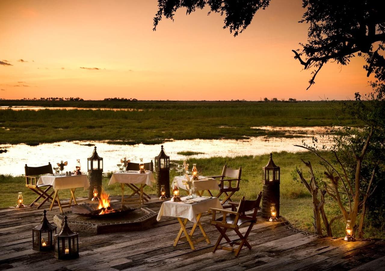 Zarafa camp dinner setting by the firepit 1280