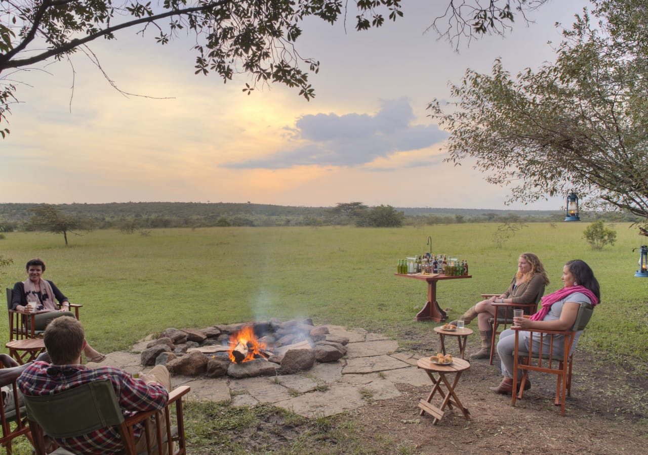 Asilia encounter mara guests around the campfire 1280