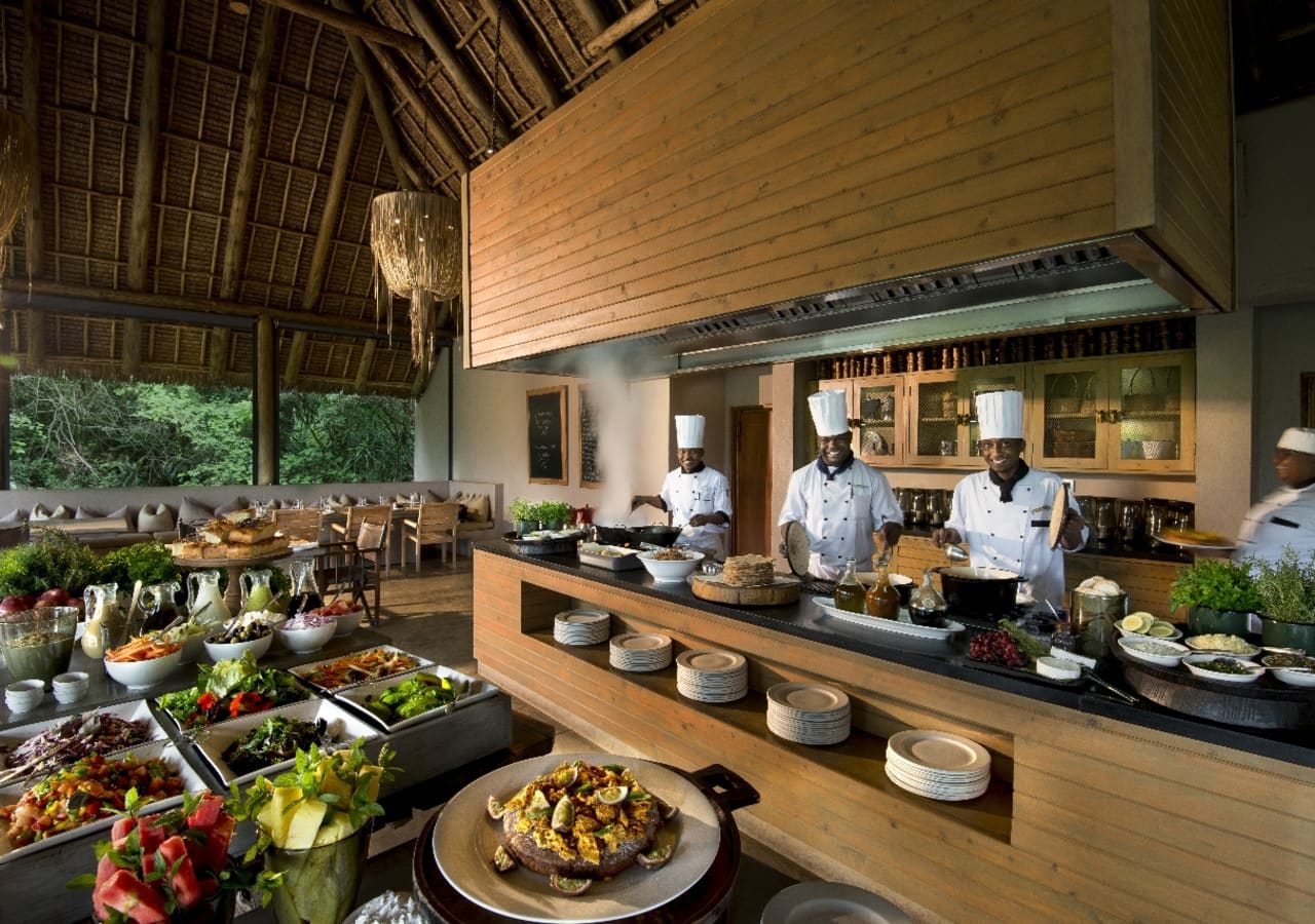 Kichwa tembo tented camp camp chefs in the dining area 1280