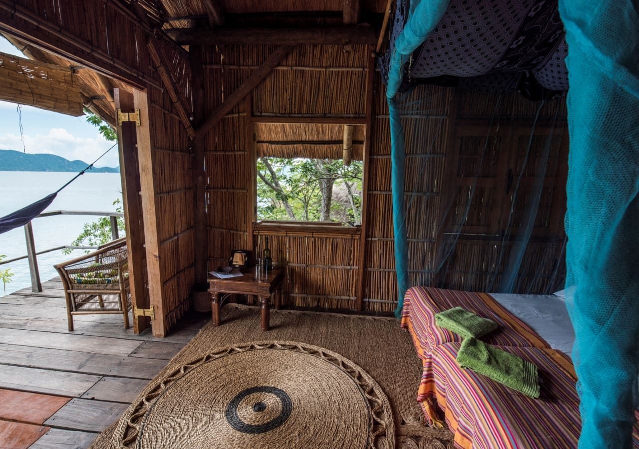 Mumbo island camp chalet bedroom with a verandah 1280