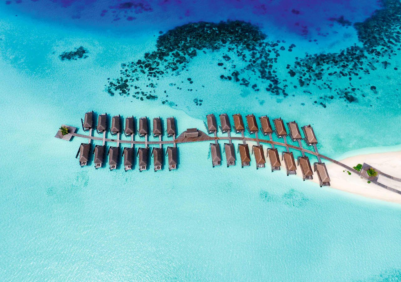 Constance moofushi resort aerial view of the water villas 1280