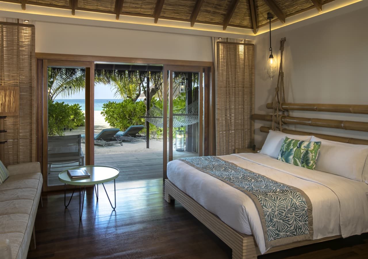 Constance moofushi resort beach villa bedroom 1280