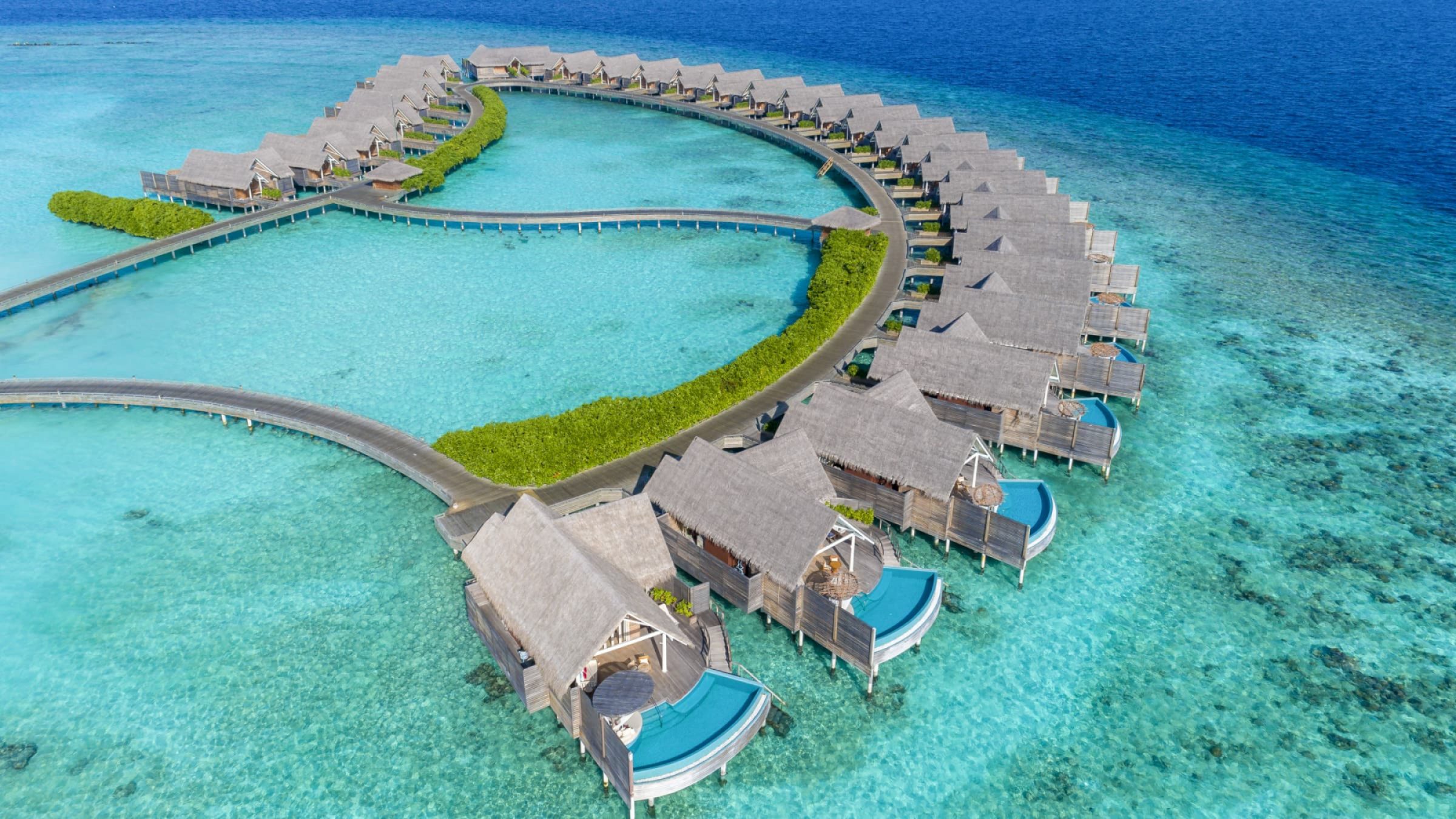 Milaidhoo island aerial view of water villas 2400