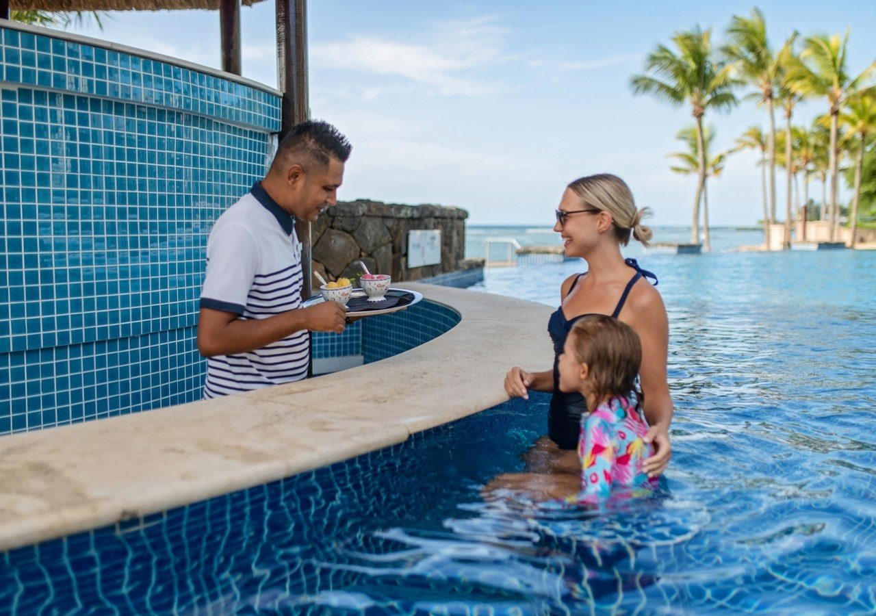 Jw marriott mauritius resort jw marriott mauritius grabbing snacks at the swim up bar 1280