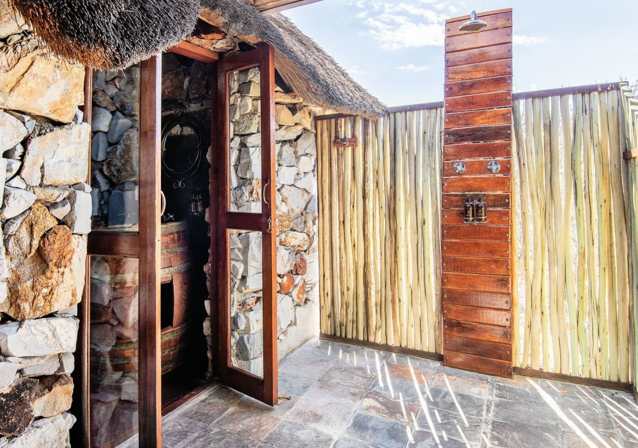 Eagle tented lodge guest suite outdoor shower 1280