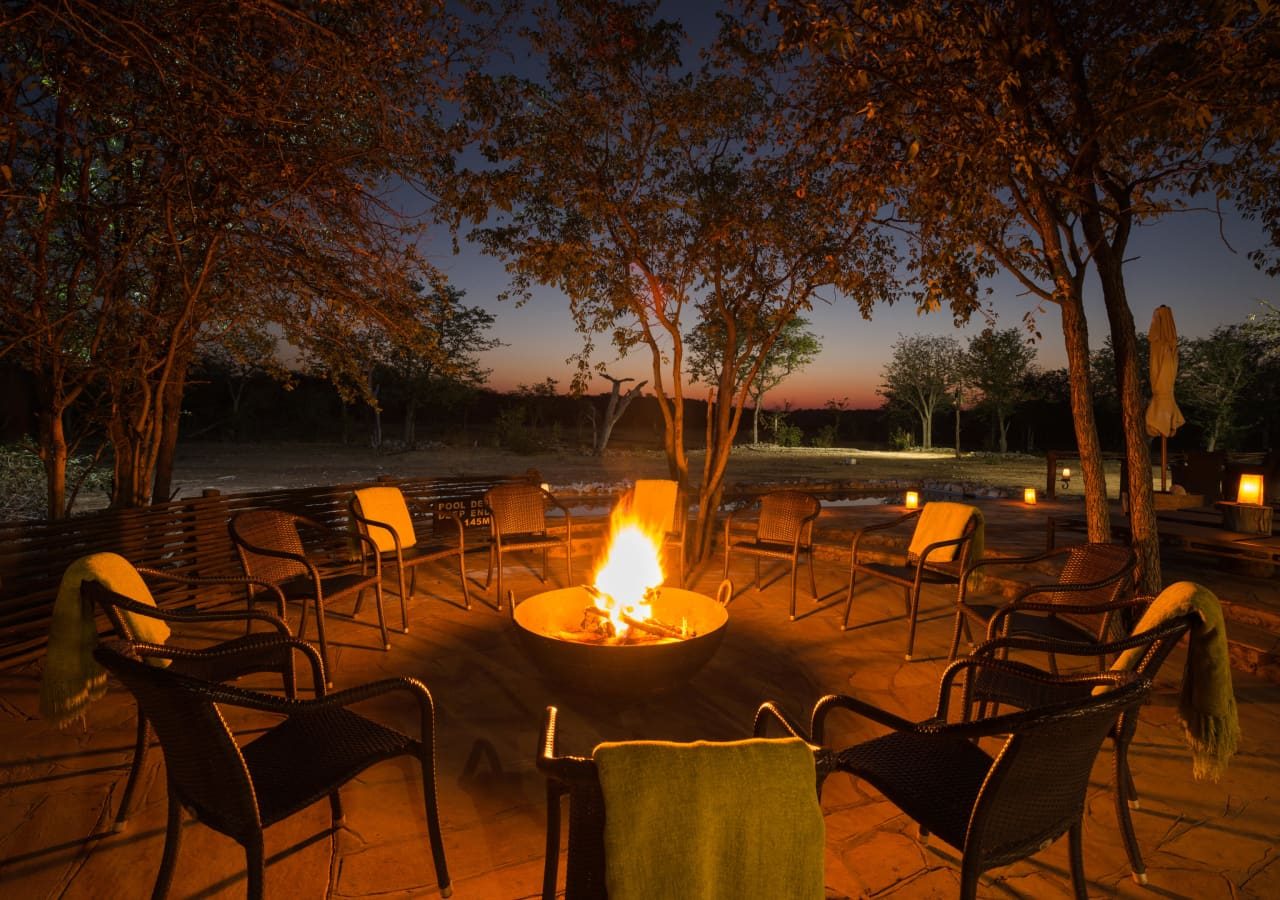 Ongava tented camp evening firepit 1280