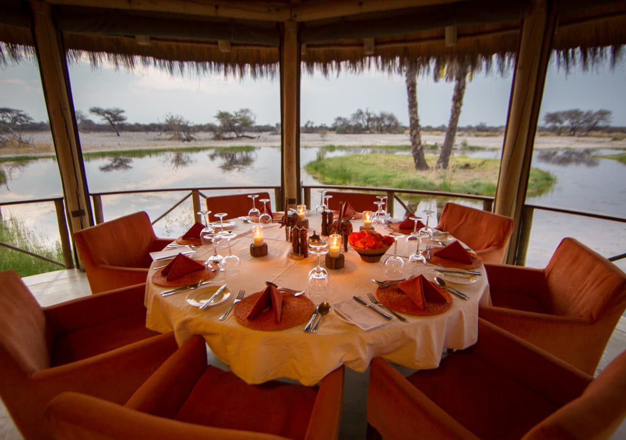 Onguma bush camp dining with a view of the watering hole 1280