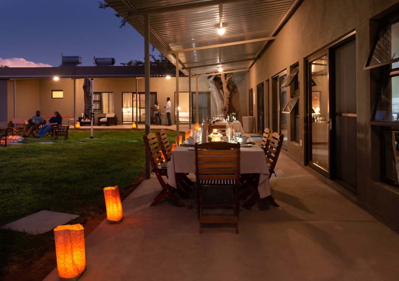 Safari house dining on the verandah at night 1280