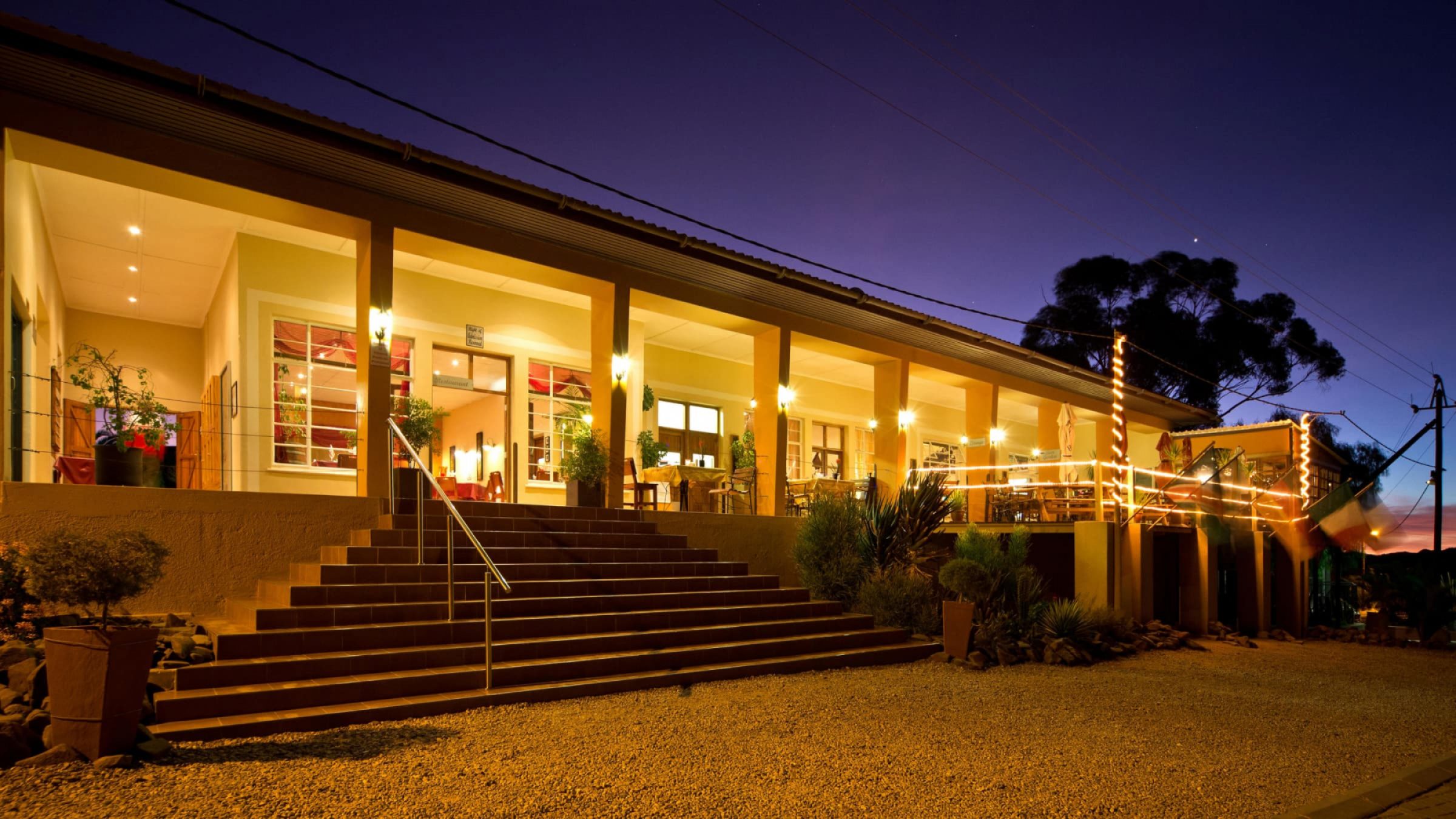 Bahnhof hotel aus front entrance at night 2400