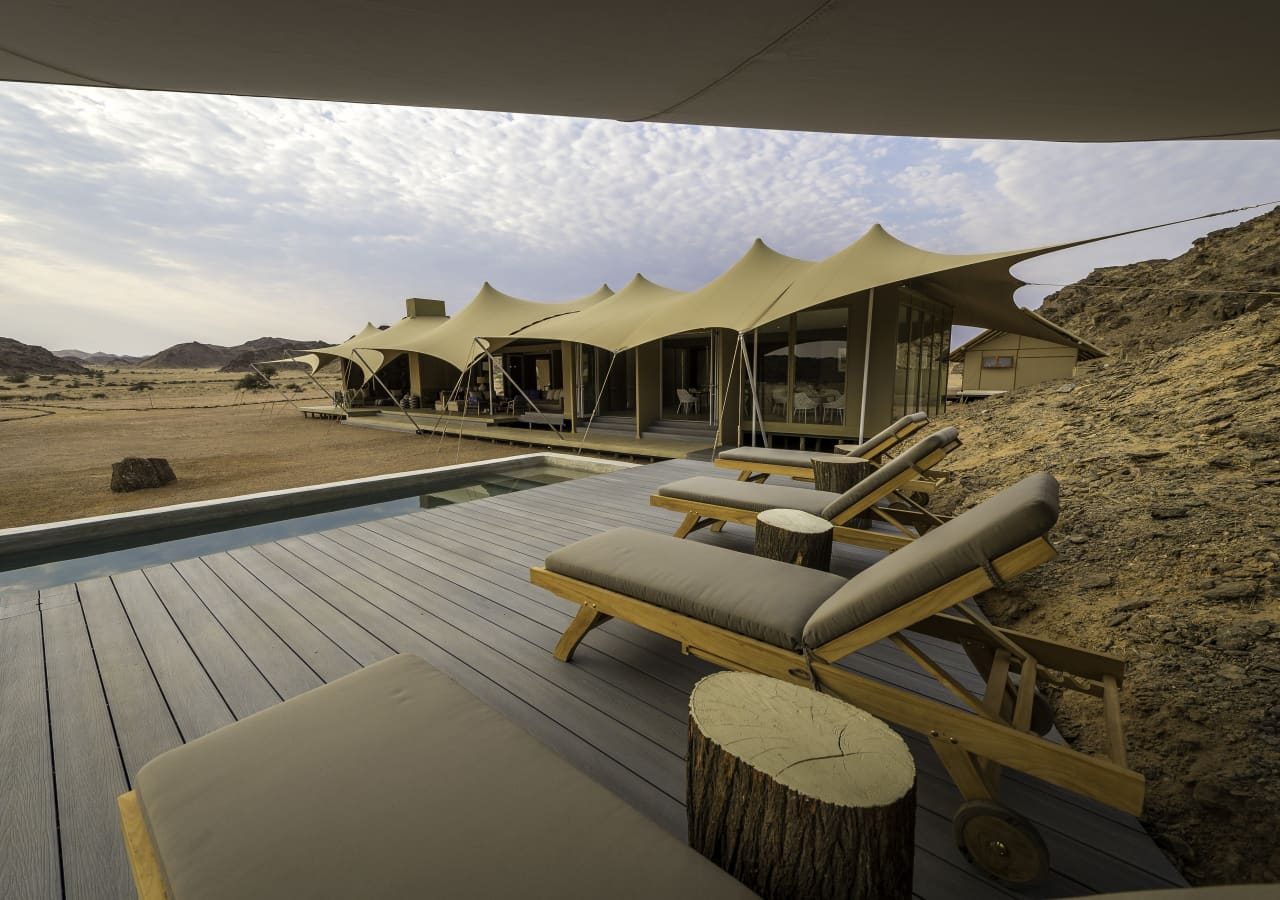 Hoanib skeleton coast camp swimming pool and deck 1280