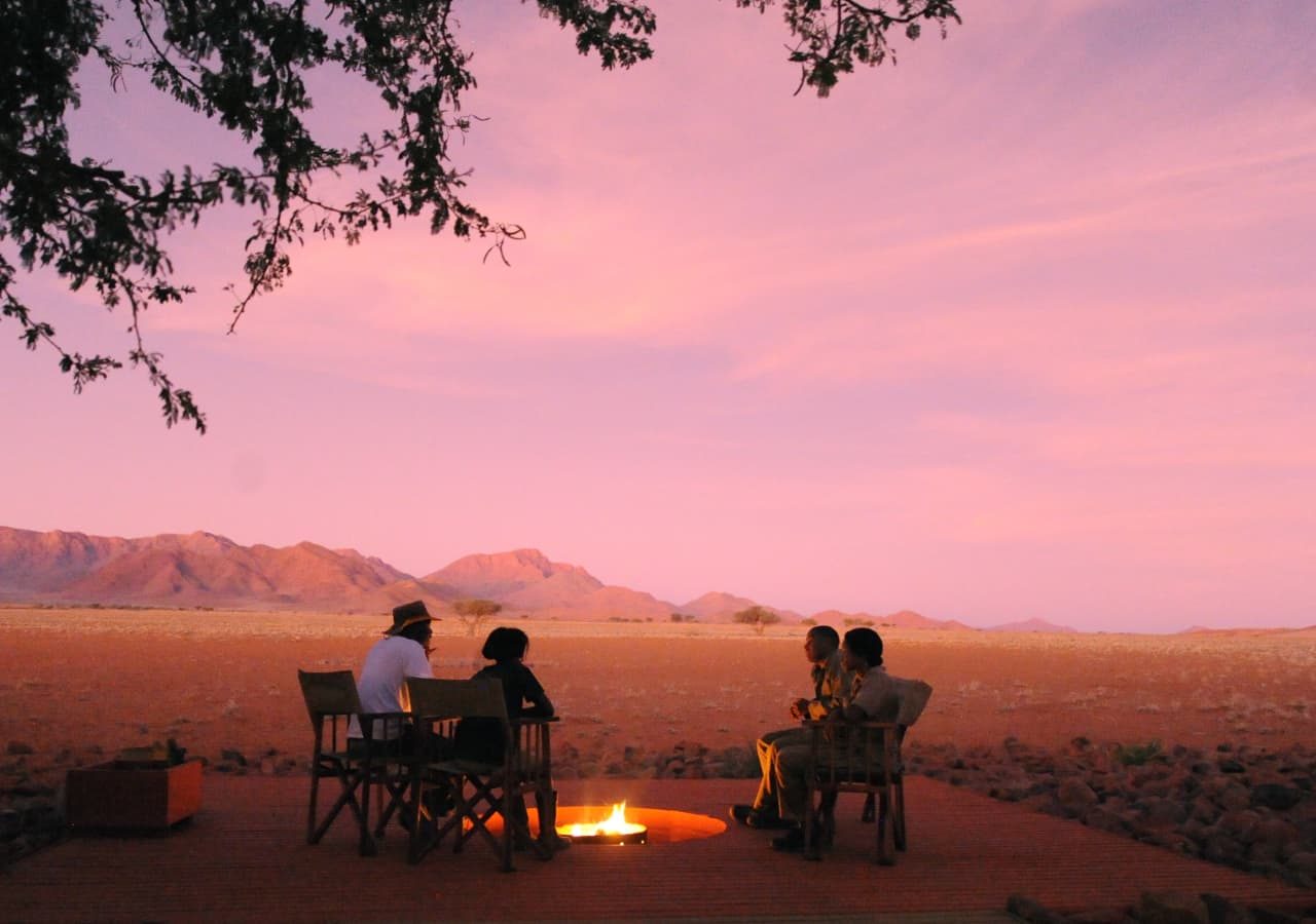 Wolwedans plains camp evening at the firepit 1280