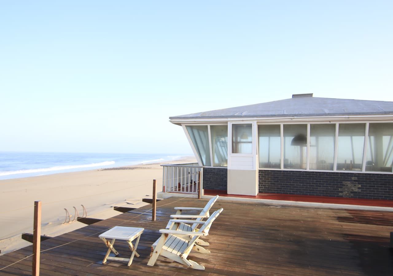 Pelican point lodge deck overlooking the sea 1280