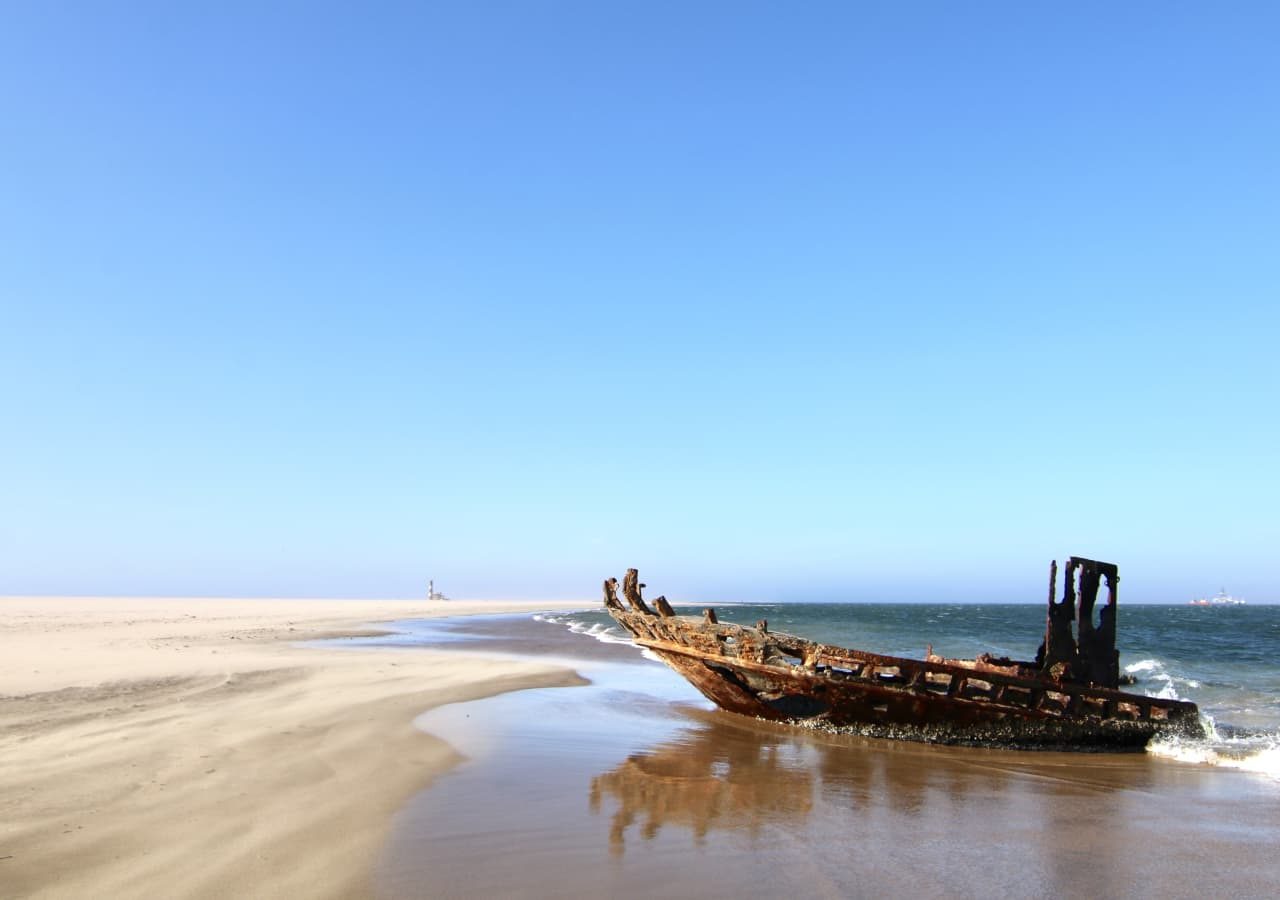 Pelican point lodge shipwreck on the beach 1280