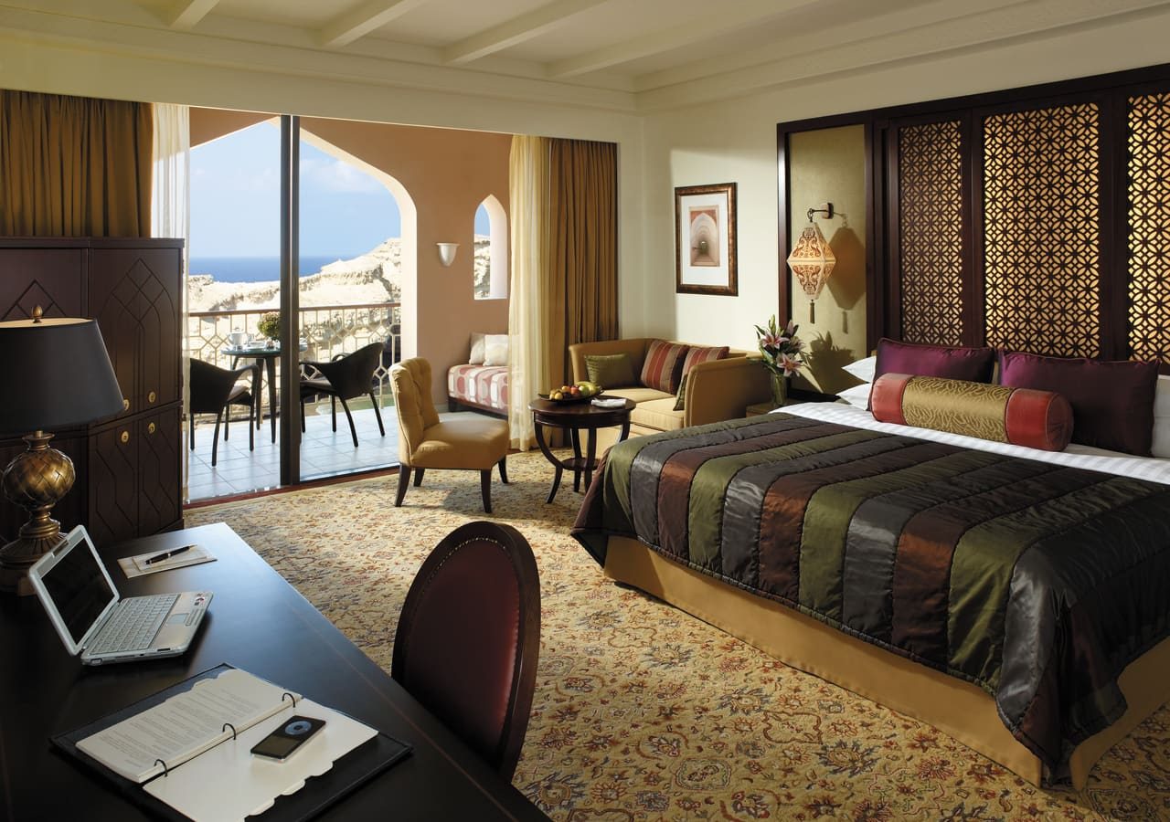 Al husn at shangri la barr al jissah resort and spa deluxe bedroom with a balcony 1280