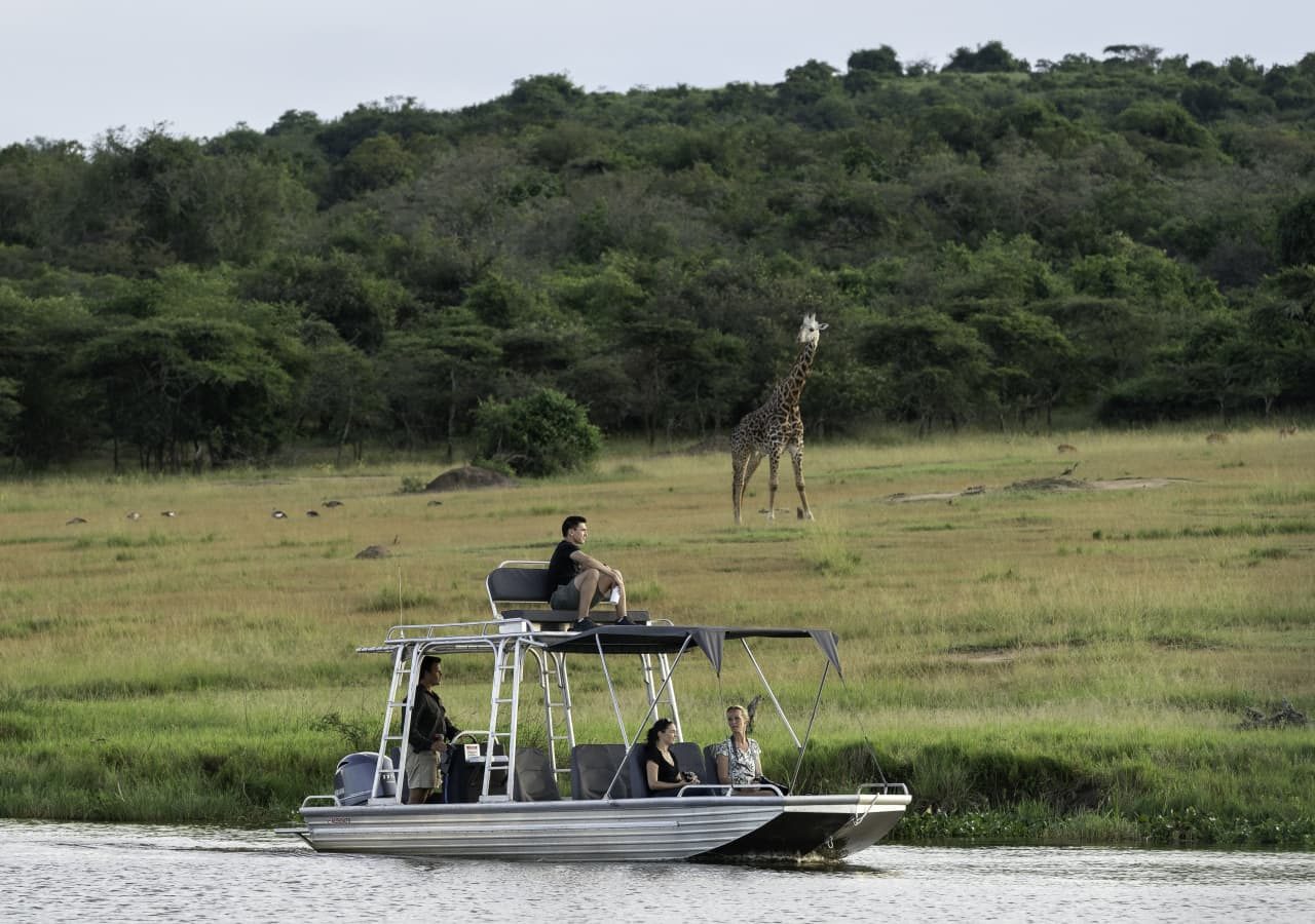 Magashi camp boat safari with up close giraffe 1280