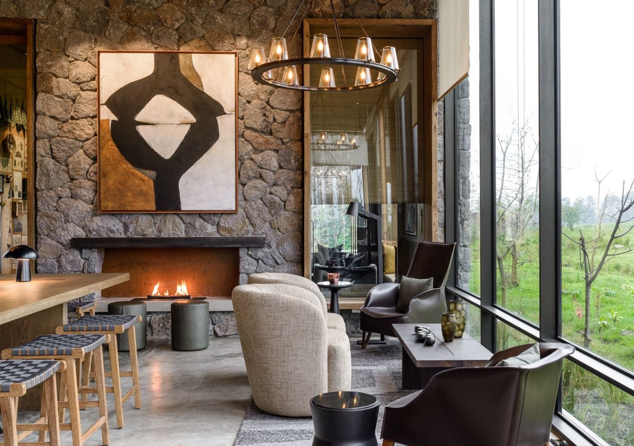 Singita kwitonda lodge lounge area with fireplace 1280