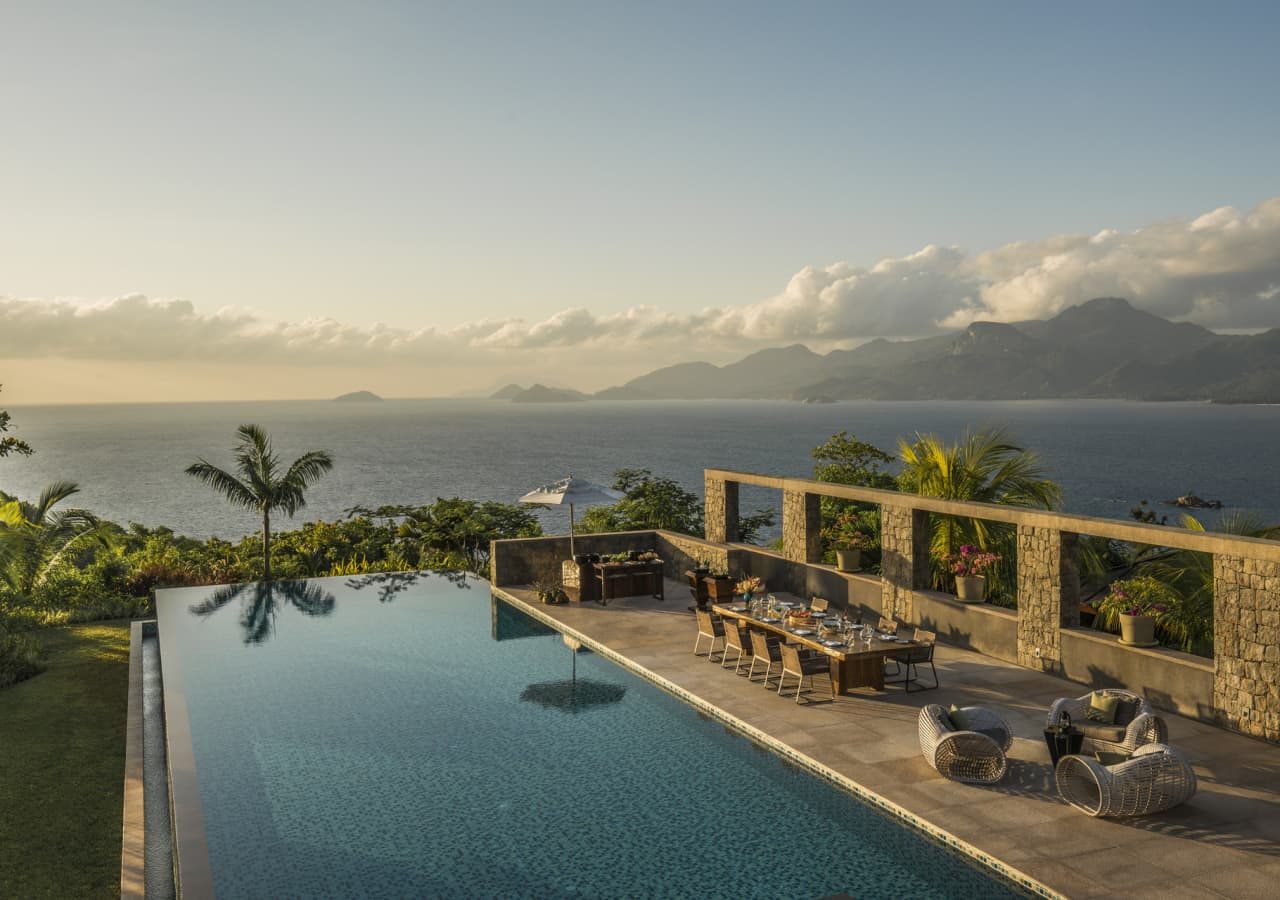 The four seasons seychelles swimming pool at sunset 1280