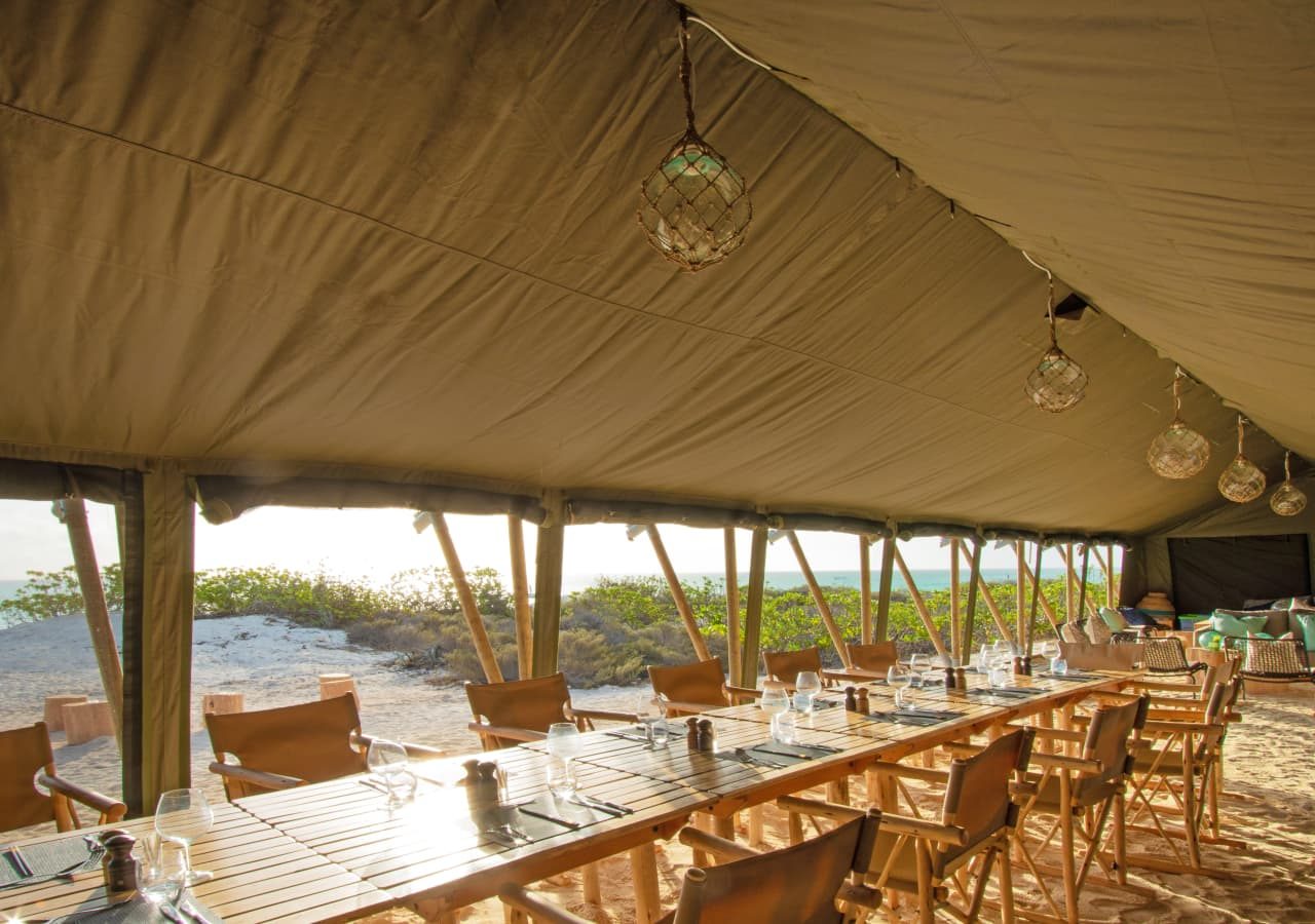 Cosmoledo atoll tented dining and lounge area 1280