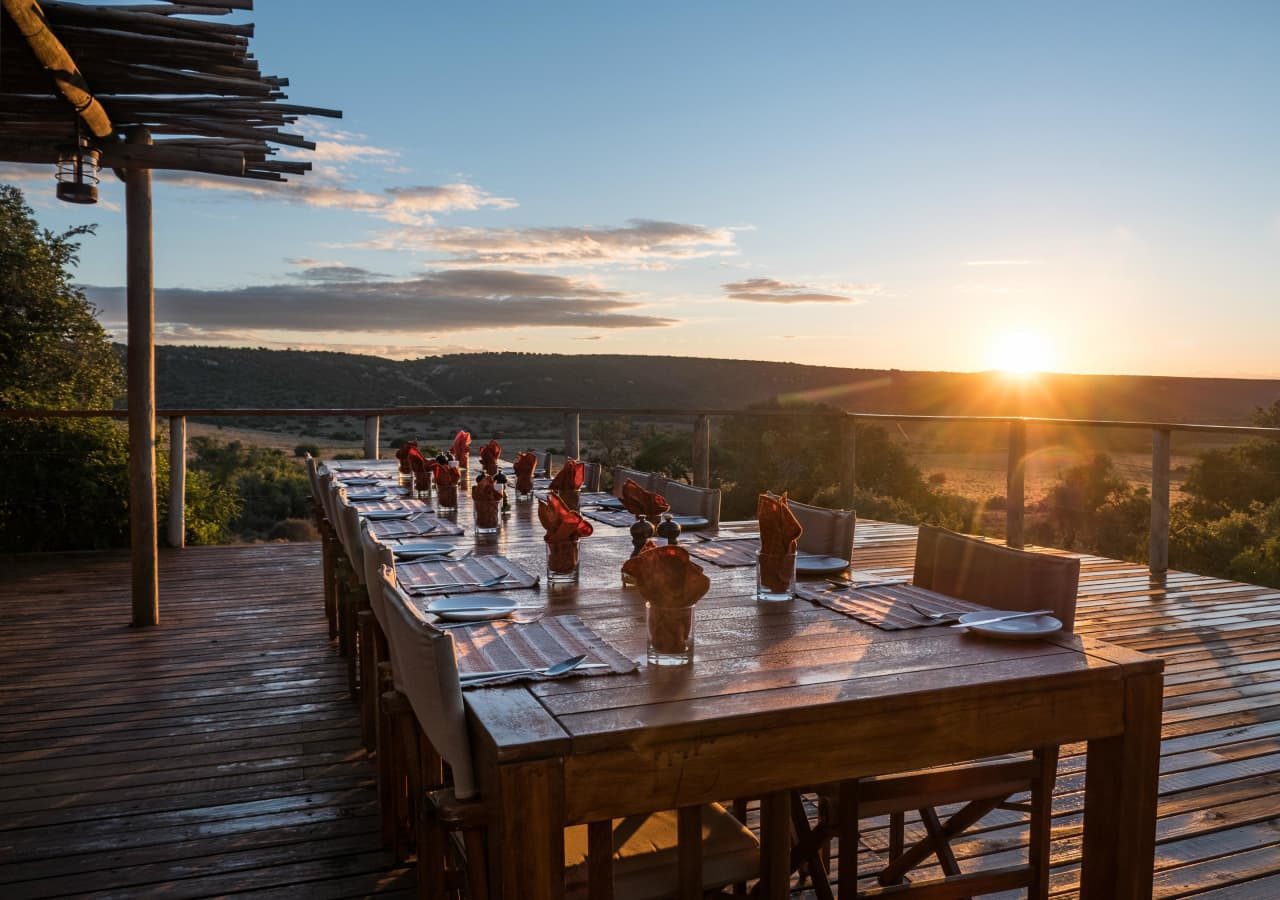 Amakhala woodbury tented camp sunset dining on the deck 1280