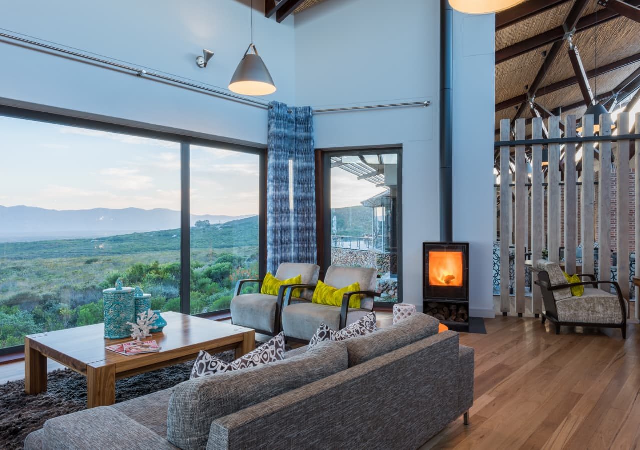 Grootbos forest lodge lounge area with fireplace 1280