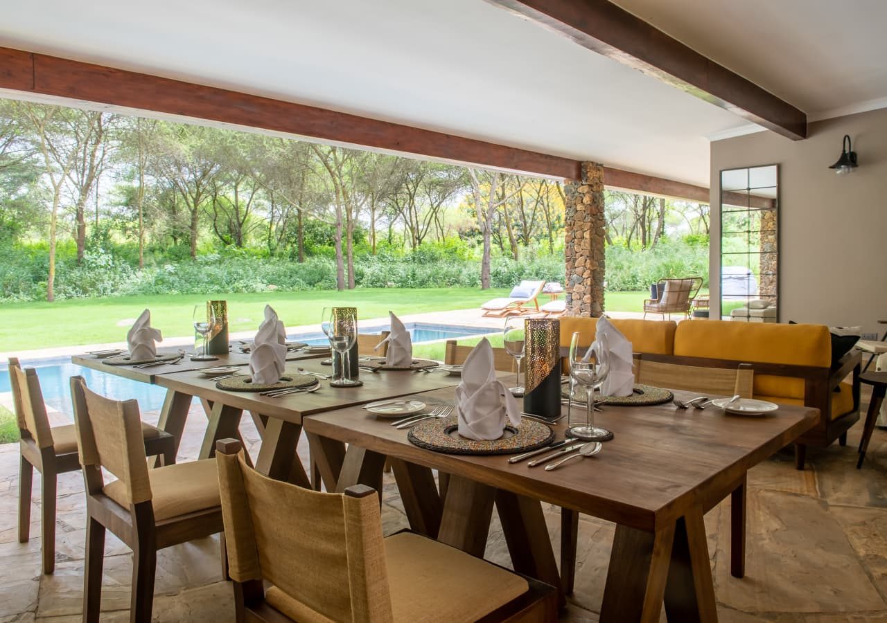 Hamerkop house by lemala dining area overlooking the pool 1280