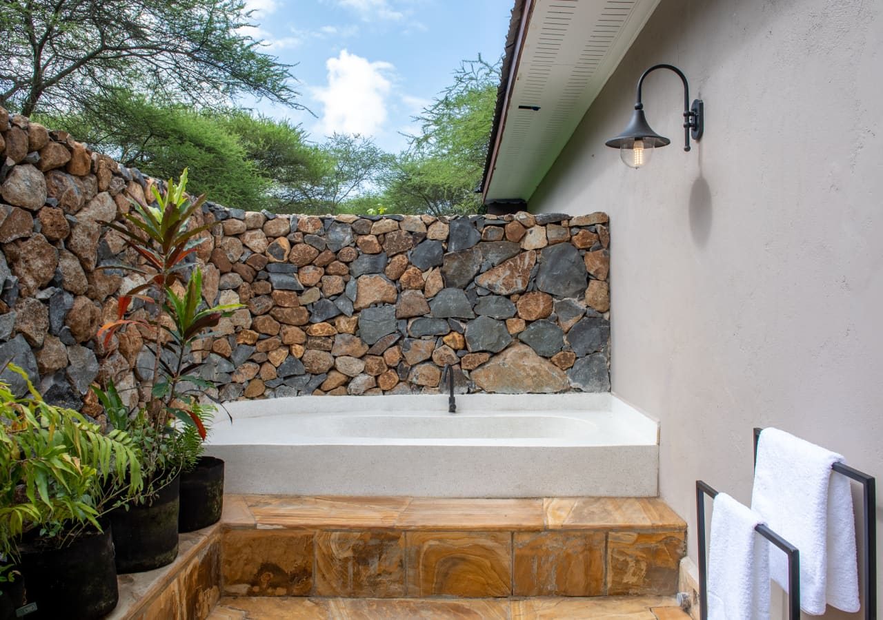 Hamerkop house by lemala outdoor bathroom 1280