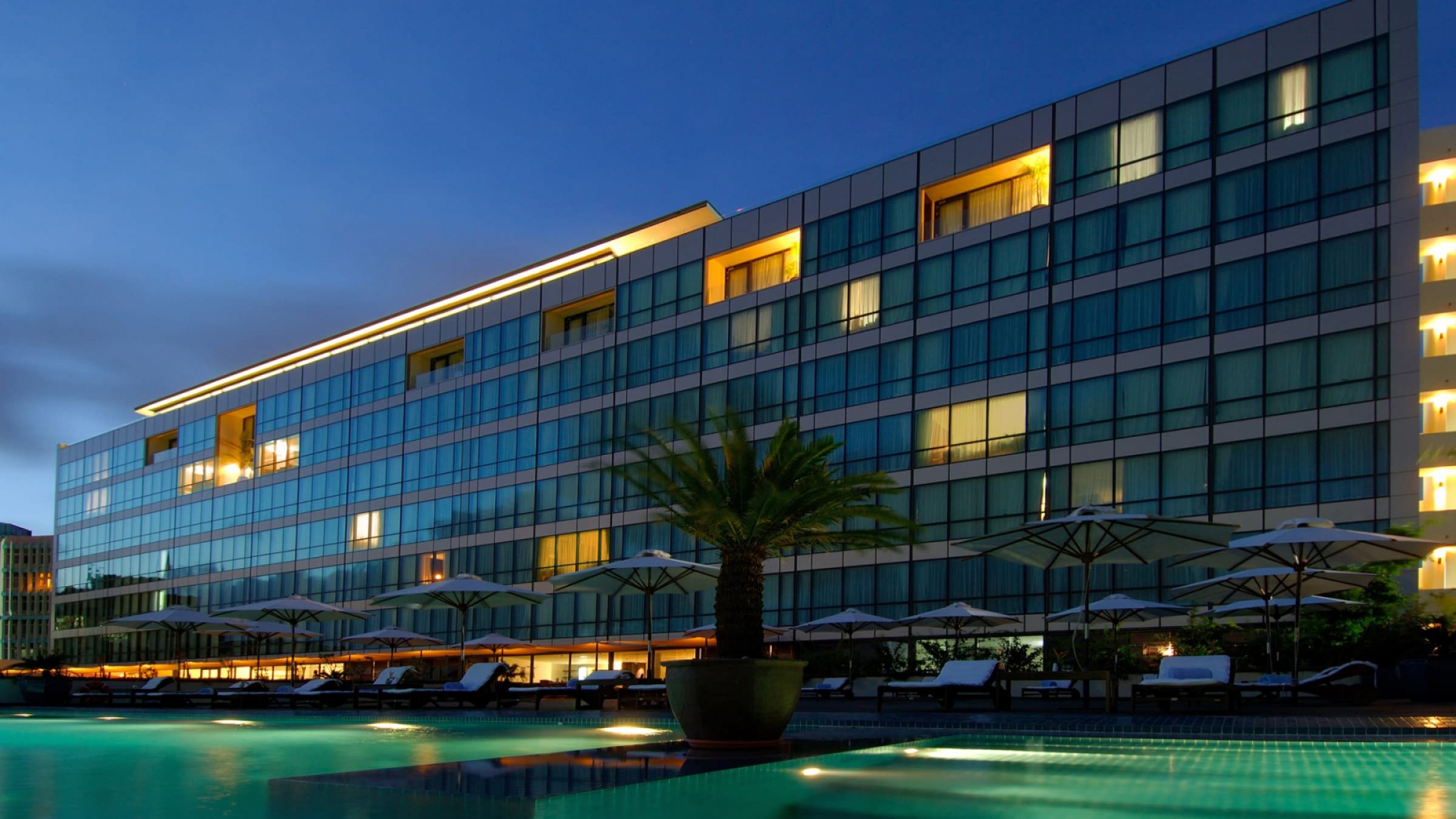 Hyatt regency dar es salaam the kilimanjaro nighttime exterior view 2400