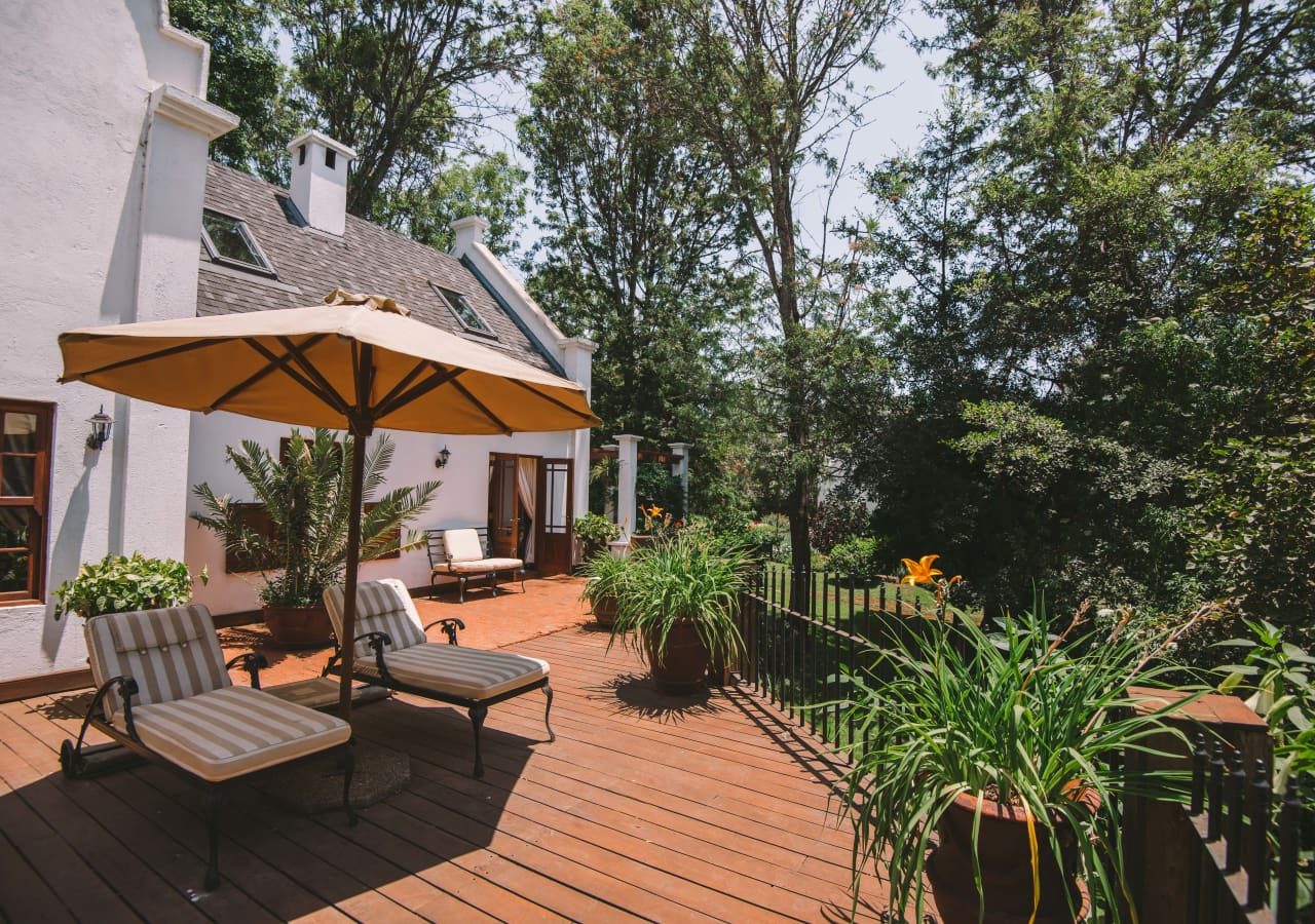 The manor at ngorongoro family cottage exterior and sun loungers 1280