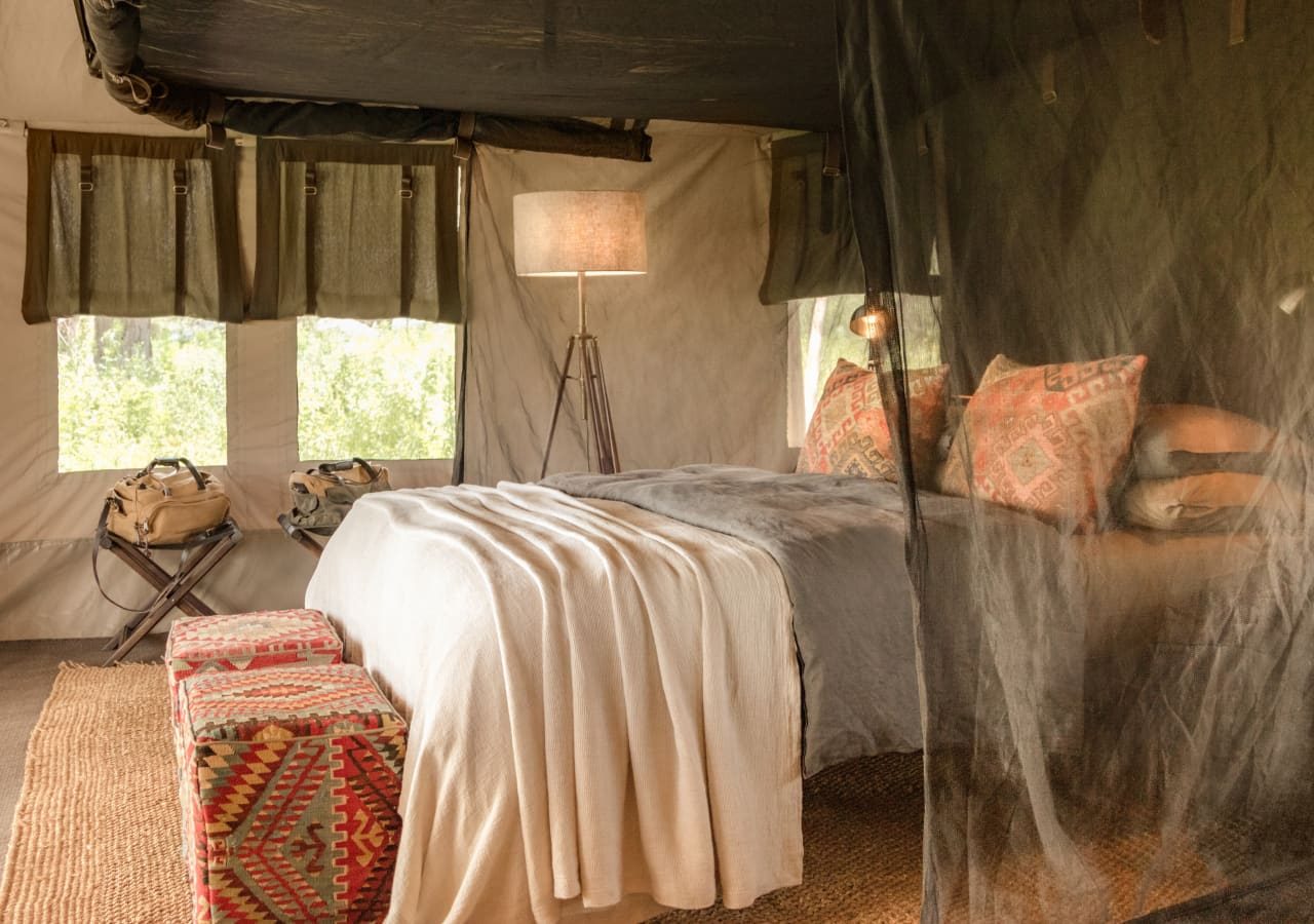 Legendary migrational camps tented bedroom interior 1280